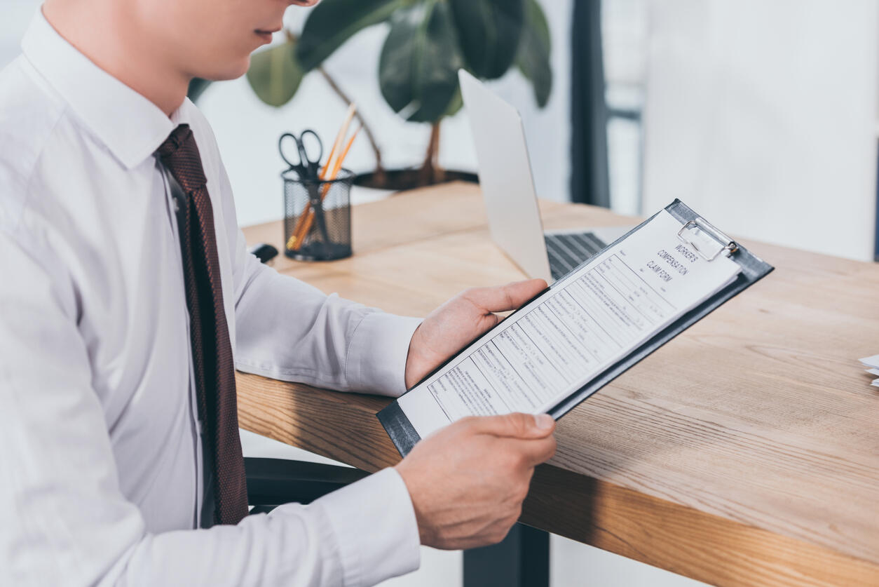 employee reading worker compensation form