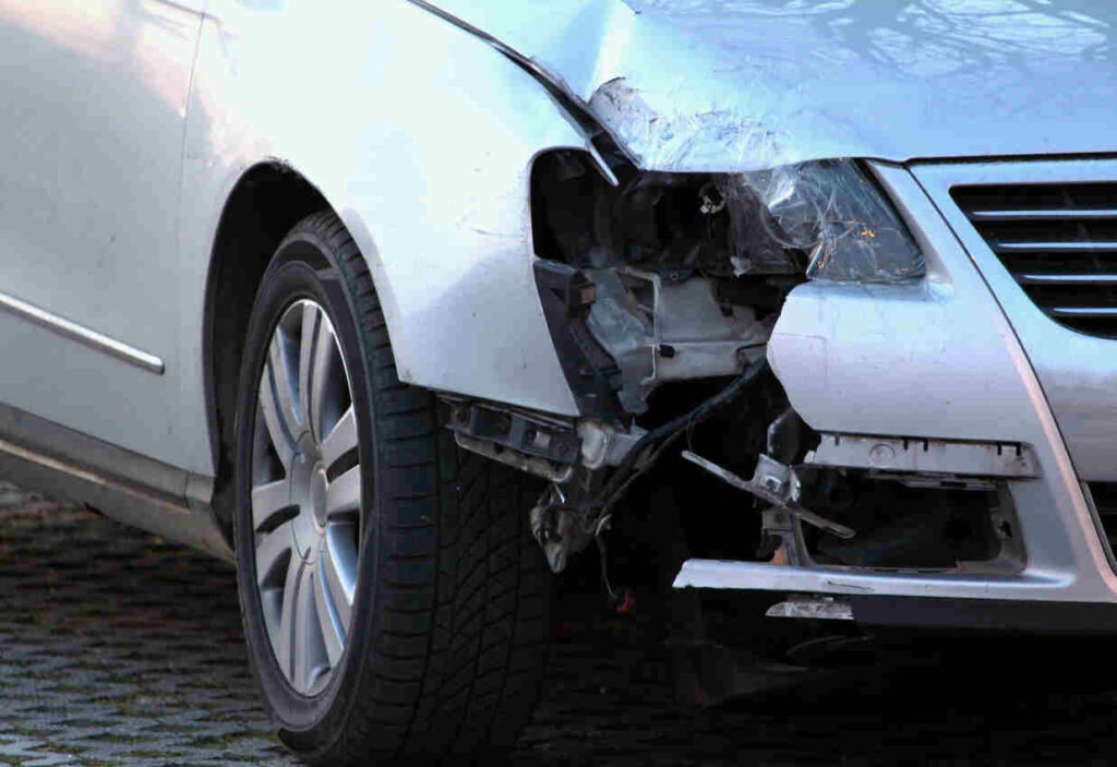 front impact car collision, modern car bumper headlight and fender damaged